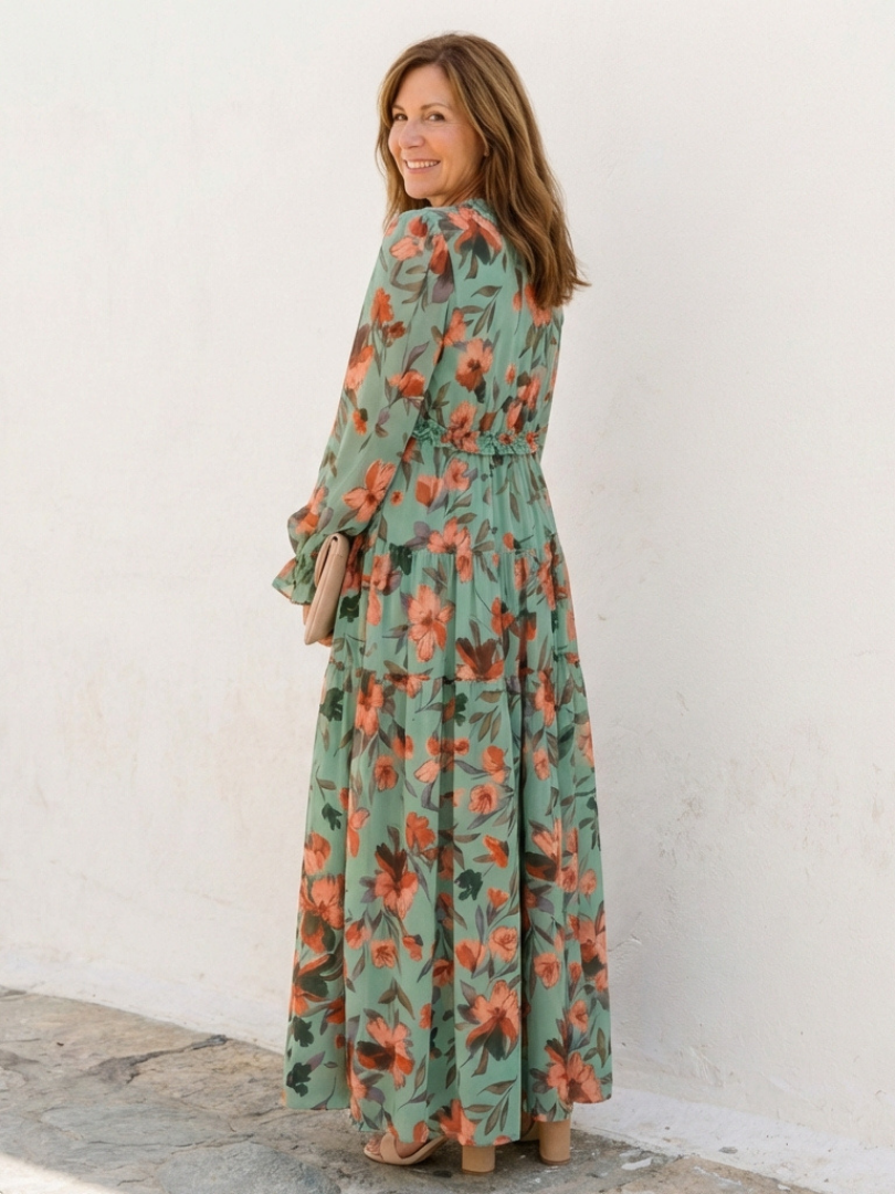 Women's spring/summer V-neck maxi dress, showcasing a vibrant floral pattern and chic long sleeves.