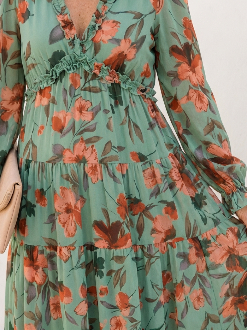 Stylish women's evening or vacation dress: elegant V-neck, long sleeves, and a stunning floral maxi design.