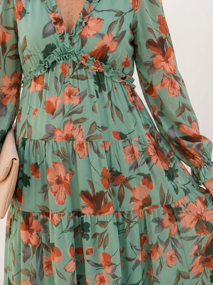 Stylish women's evening or vacation dress: elegant V-neck, long sleeves, and a stunning floral maxi design.
