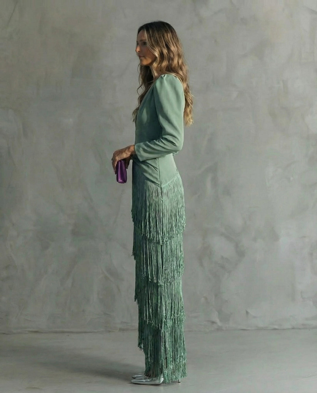 Stylish women's maxi dress featuring a V-neck and playful fringe, a chic choice for parties.