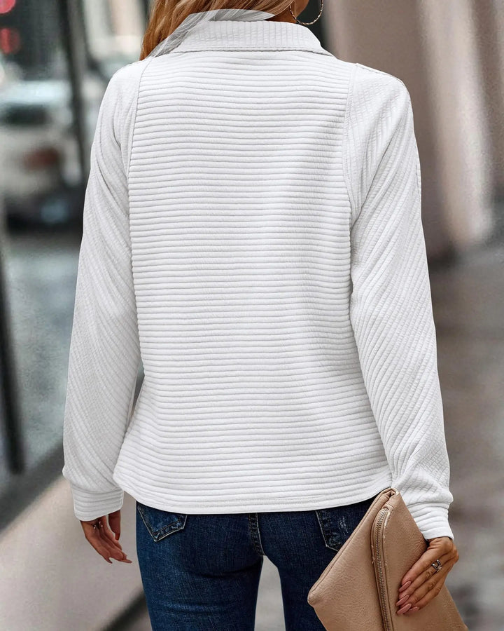 Soft knit women's v-neck half-zip jumper. An elegant and comfortable sweater for stylish winter apparel.