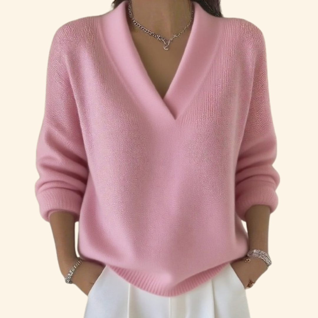 Cozy women's long sleeve V-neck sweater, versatile for casual or dressed-up looks. A comfortable wardrobe staple.