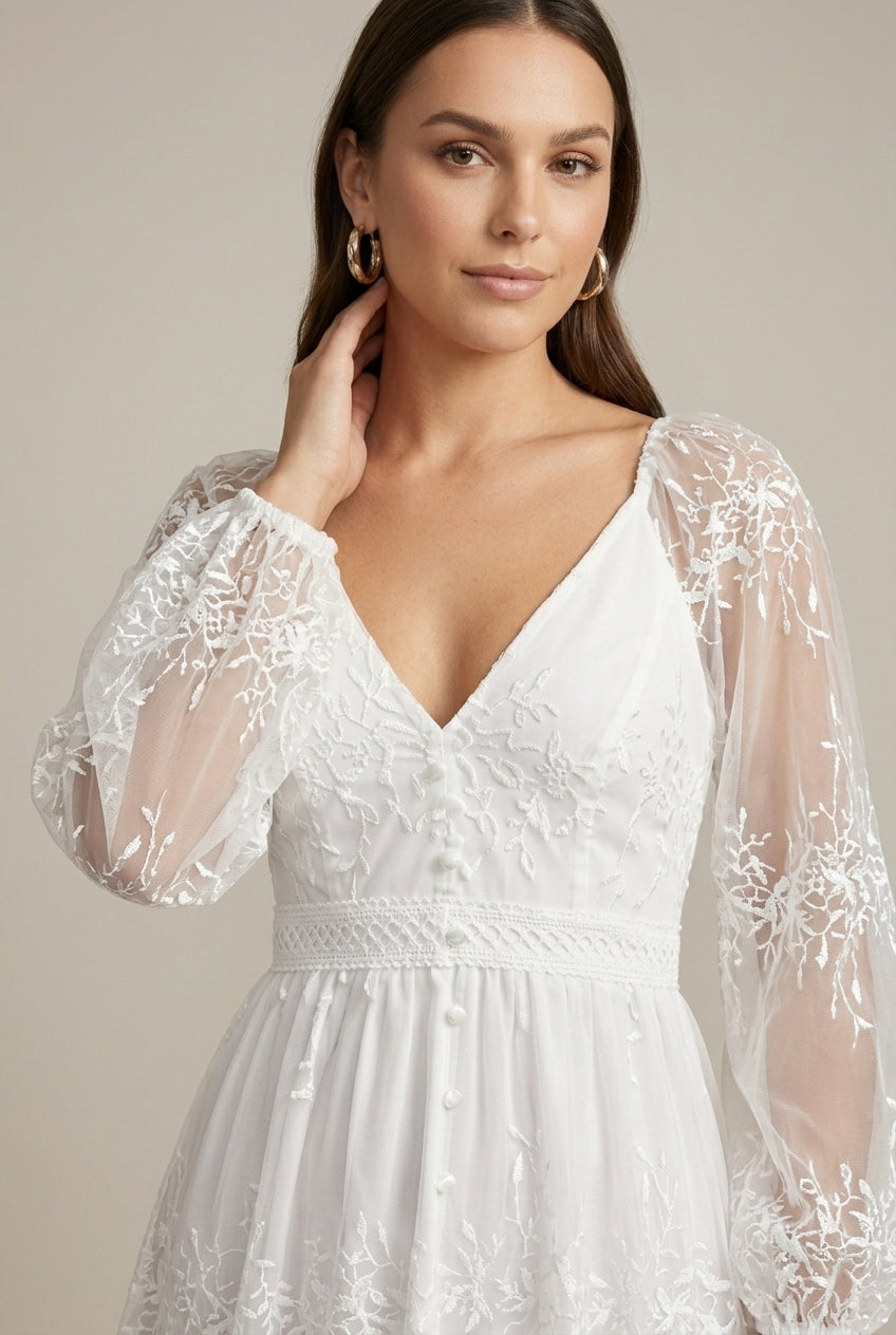 Stunning women's V-neck long sleeve tiered maxi dress featuring delicate embroidery, suitable for elegant occasions.