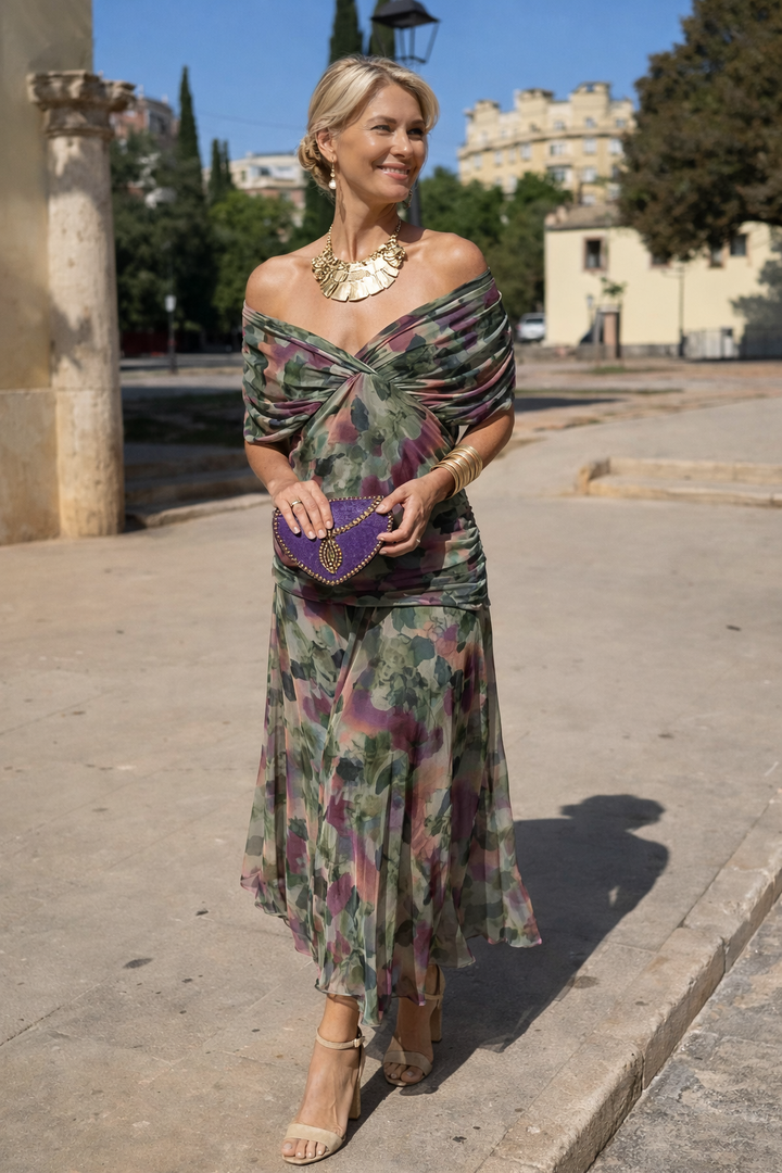 Chic women's wrap style maxi dress with a deep V-neck, perfect for elegant parties.