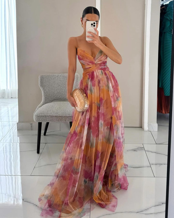 Elegant women's V-neck maxi dress with abstract print, pleated skirt & fitted bodice, perfect for summer occasions.