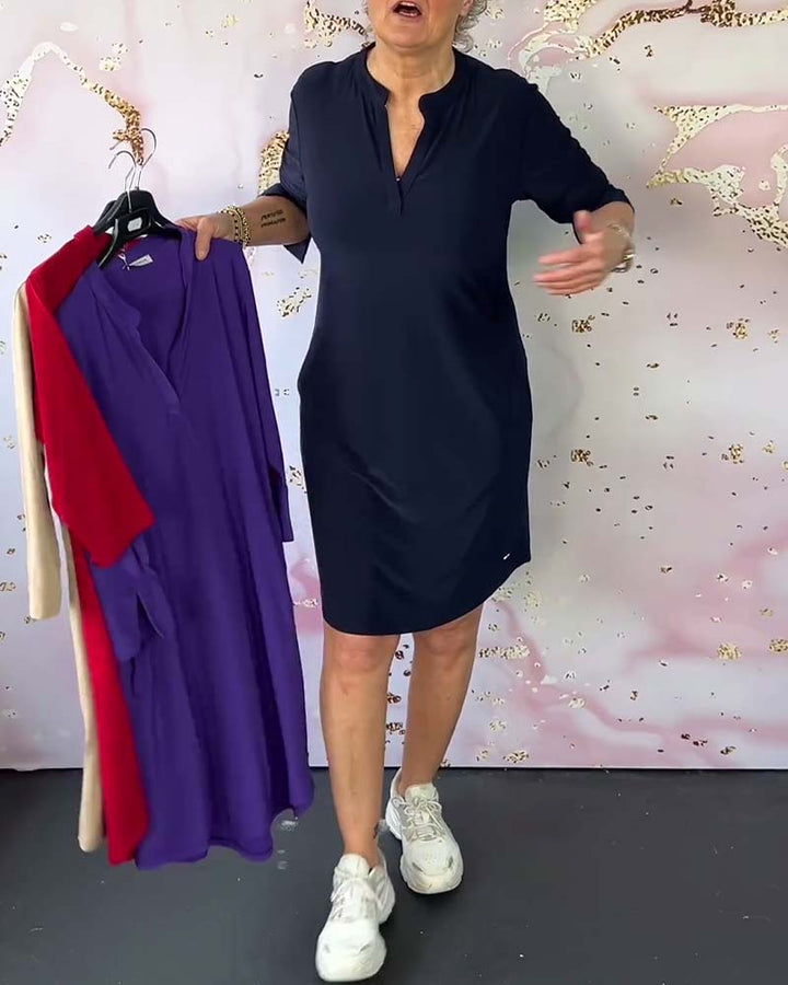 Versatile V-neck women's midi dress, easily styled for casual outings or elegant evening events.