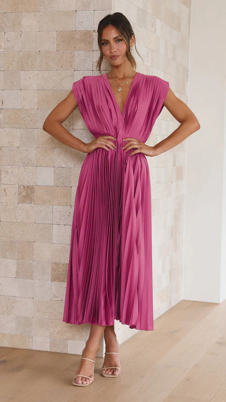 Stylish women's V-neck midi dress with a comfortable, flowing pleated skirt, suitable for day or evening.