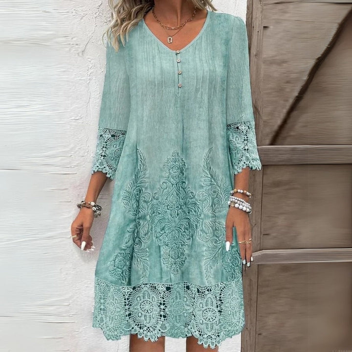 Stylish women's V-neck embroidered midi dress with three-quarter sleeves & relaxed fit for effortless spring casual.