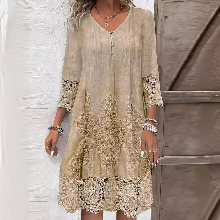 Beautiful women's embroidered V-neck midi dress featuring delicate lace trim, ideal for elegant spring fashion.