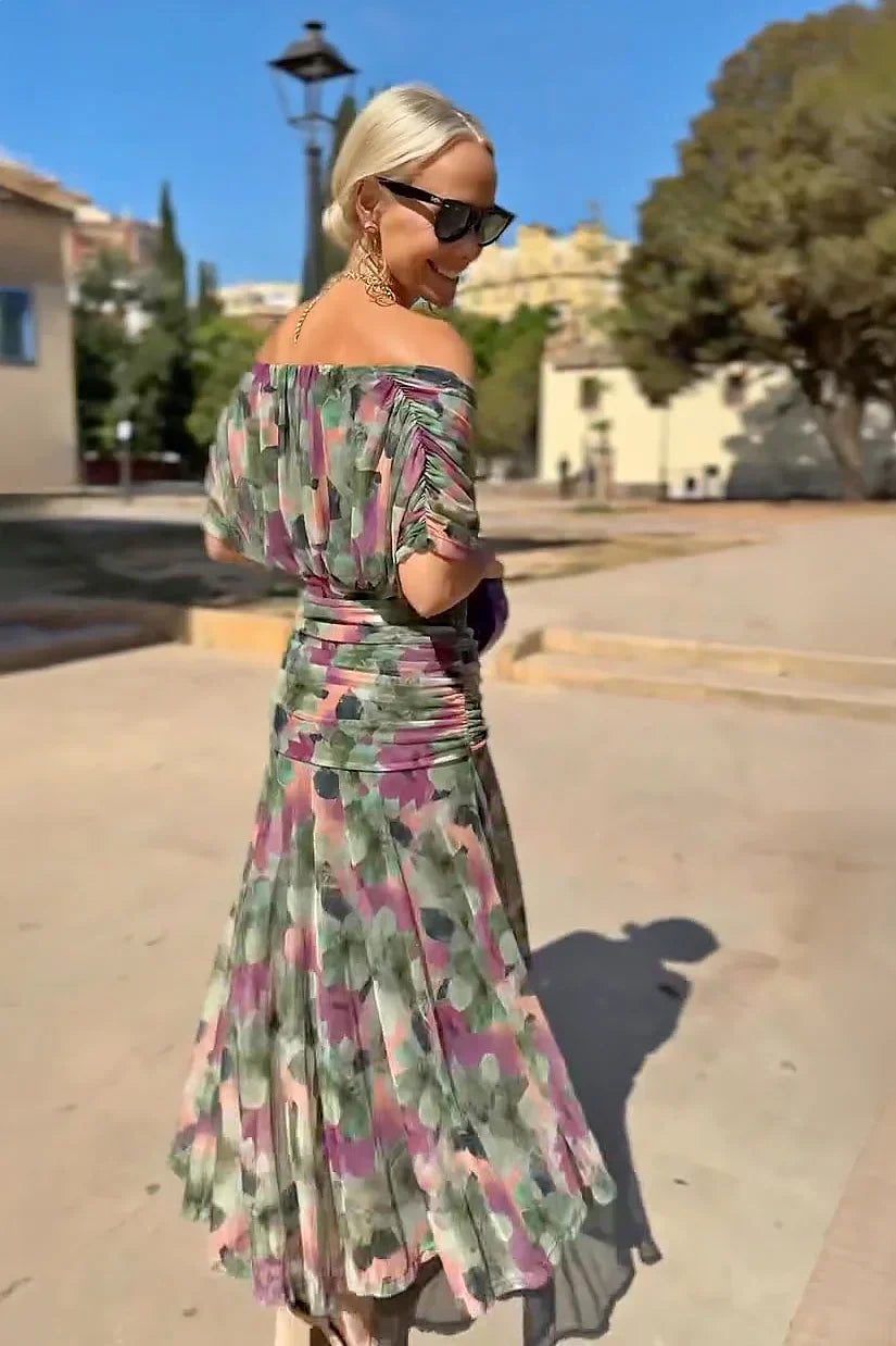 Women's special occasion maxi dress with an elegant V-neck and flowy, colorful design.