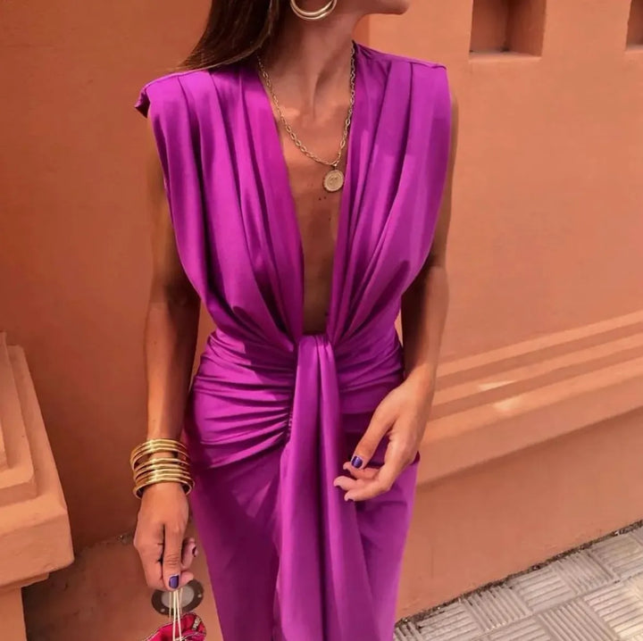 Sophisticated V-neck pleated midi dress for women, ideal as a wedding guest or party dress. Sleeveless & elegant.