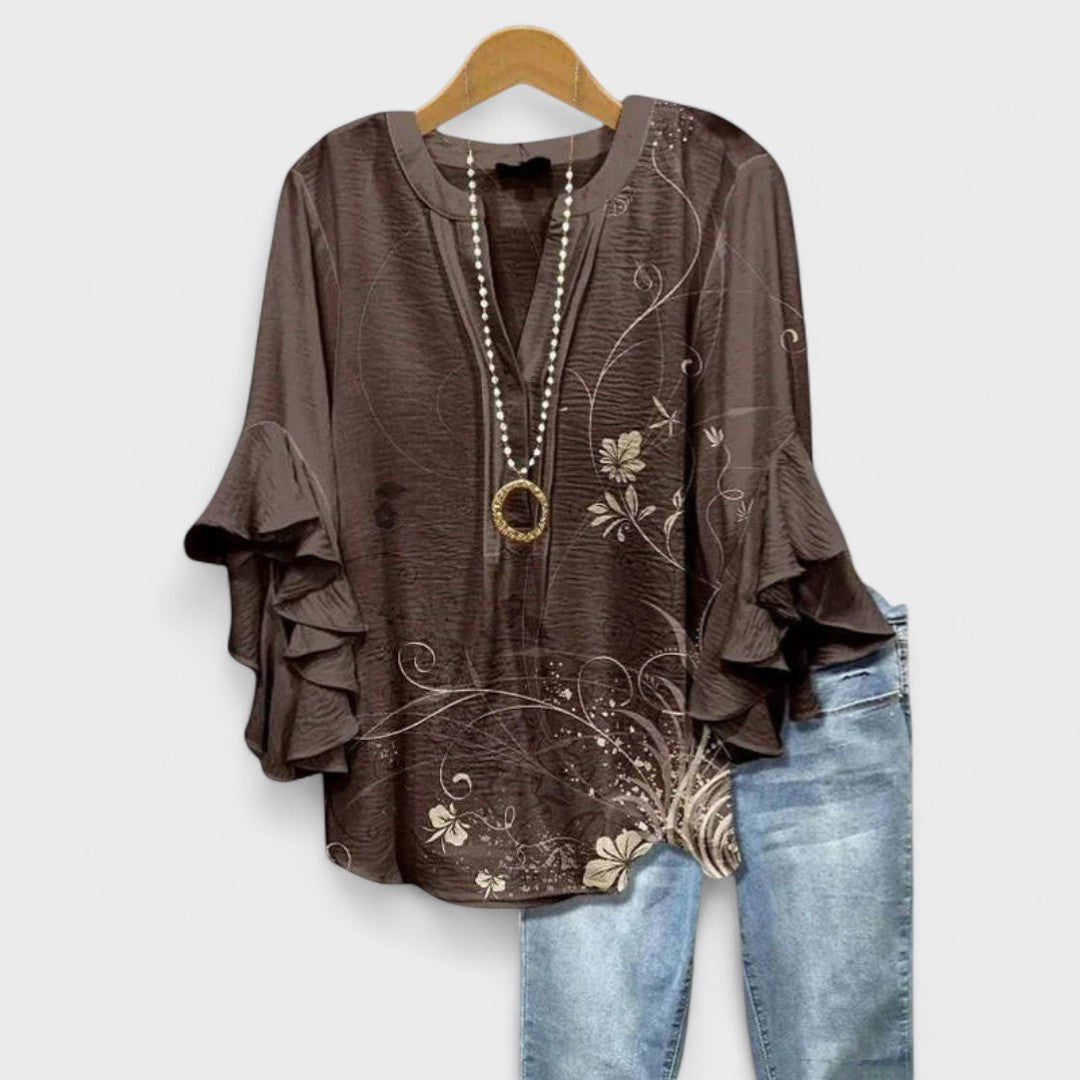 Stylish V-neck women's blouse featuring graceful ruffle sleeves, suitable for elegant casual or office wear.