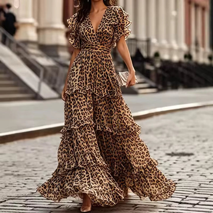 Trendy leopard print V-neck maxi dress with ruffles & flutter sleeves. A stylish long dress for special events.