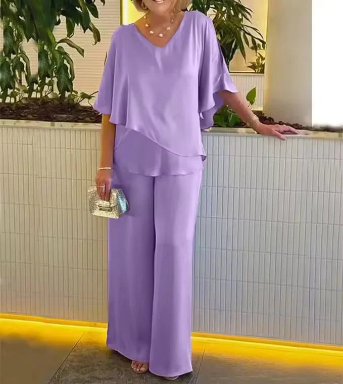 Stylish women's V-neck top and wide-leg pant co-ord set, perfect for spring or summer fashion.