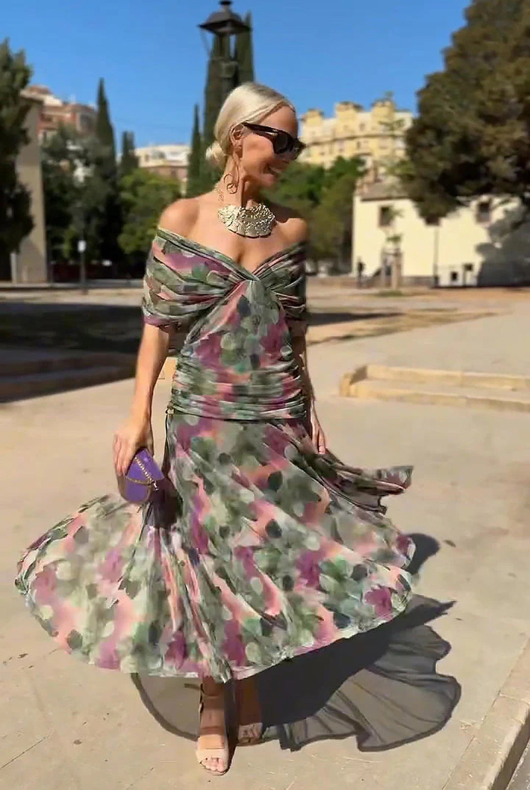 Women's elegant V-neck wrap maxi dress, a flowing formal evening gown for sophisticated occasion wear.