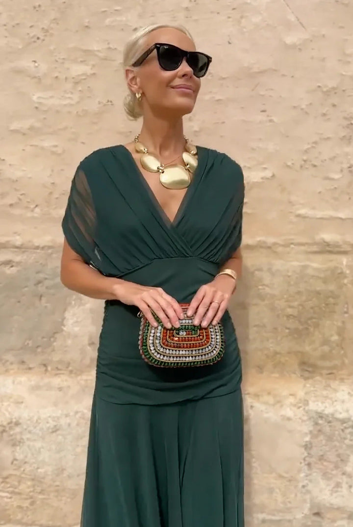 Luxurious women's V-neck wrap maxi dress with a flowing silhouette, perfect for sophisticated style.