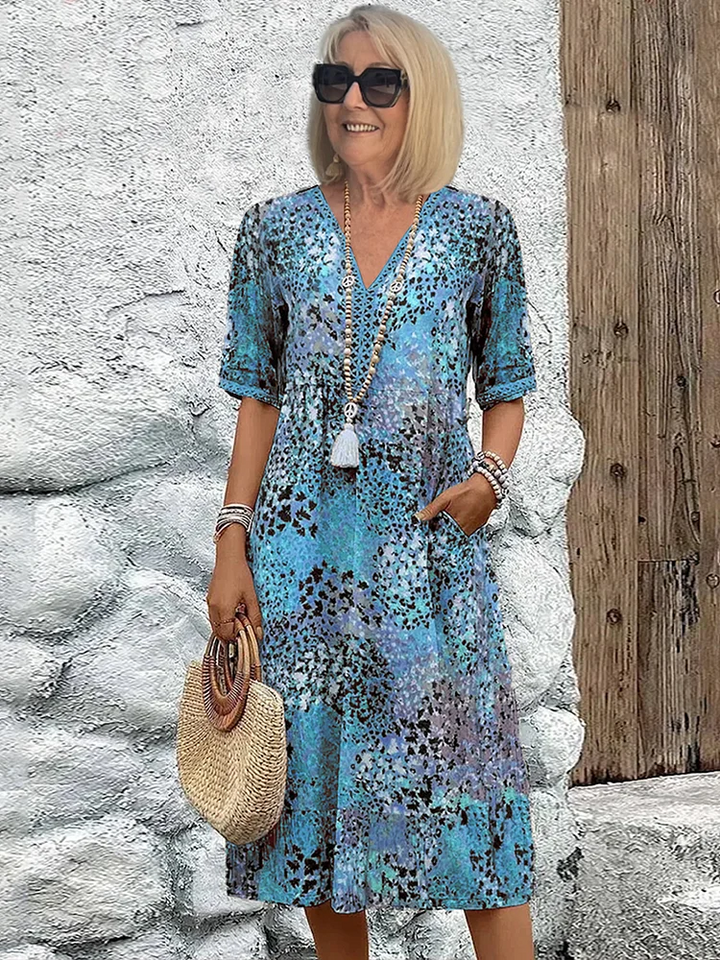 Comfortable women's elegant midi dress featuring a vibrant, eye-catching pattern. Ideal for modern style.