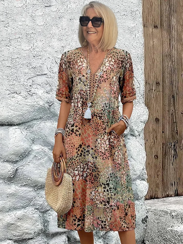Women's elegant vibrant pattern midi dress. A comfortable, flowing design suitable for spring & summer.
