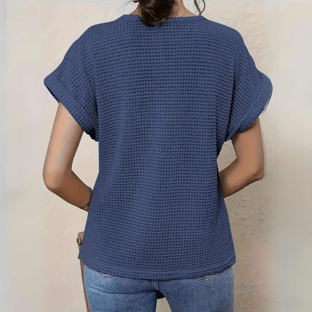 Elegant women's vintage lace top, a chic summer blouse. Versatile fashion shirt for casual wear.