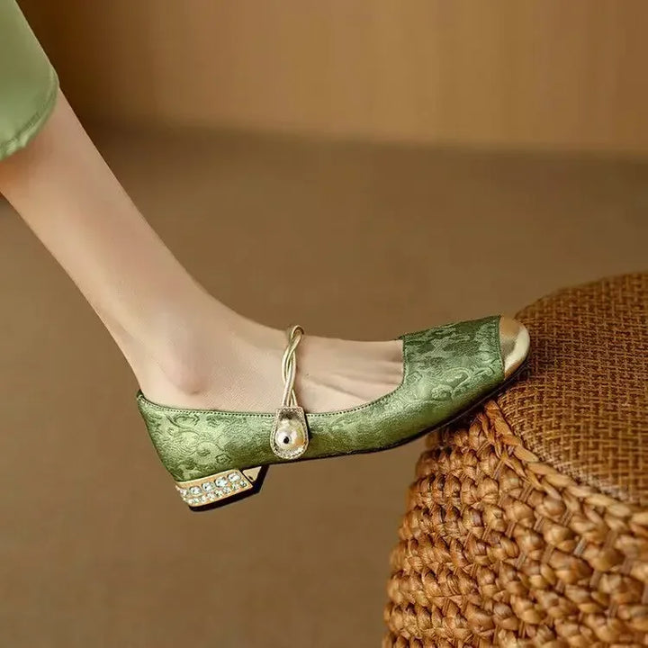 Detailed shot of comfortable women's vintage pearl strap Mary Jane heels.