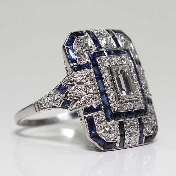 Elegant women's vintage silver ring with a prominent blue gemstone. Handmade statement jewelry, perfect gift for her.