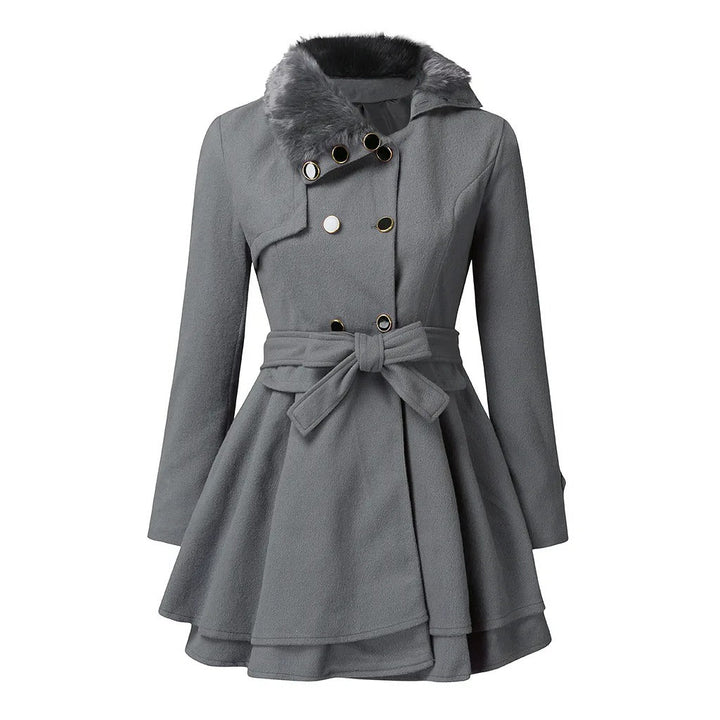 Elegant women's vintage trench coat with faux fur collar and cuffs, double-breasted and belted for a sophisticated look.