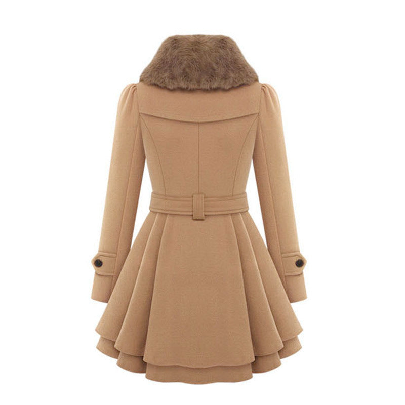 Women's double-breasted trench coat with a flattering belted waist and plush faux fur collar, embodying timeless elegance.