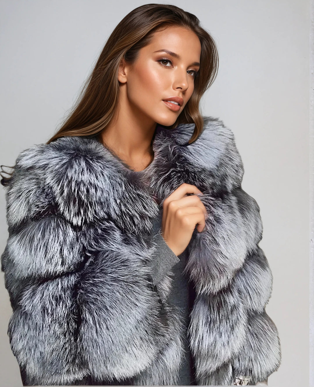 Glamorous women's oversized winter jacket, providing cozy warmth. Elegant & stylish outerwear for cold weather fashion.