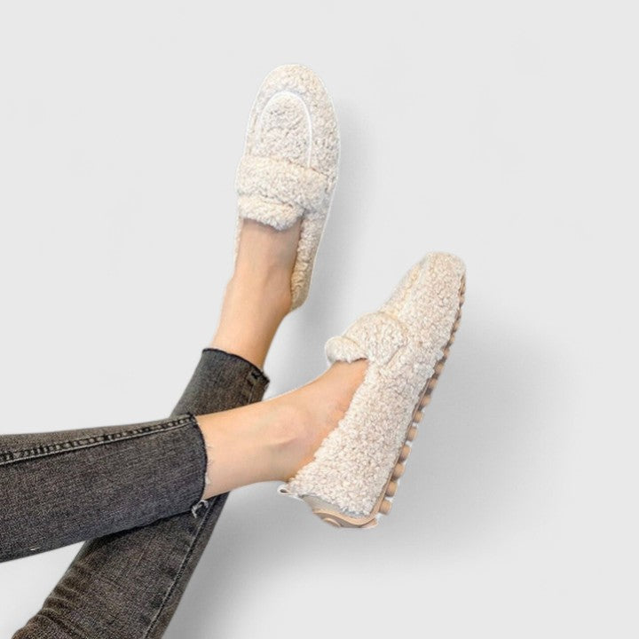 Stylish women's loafer slippers for elegant home comfort. Warm indoor shoes with non-slip sole, perfect for winter.