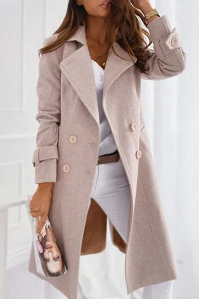 Fashionable women's elegant warm winter coat. Sophisticated outerwear with a classic, structured fit.