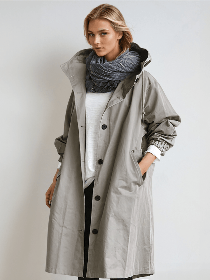 Elegant women's water-repellent trench coat, perfect for transitional weather and versatile styling.