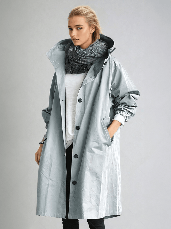 Classic women's trench coat with water-repellent finish, offering elegant and timeless style for any season.