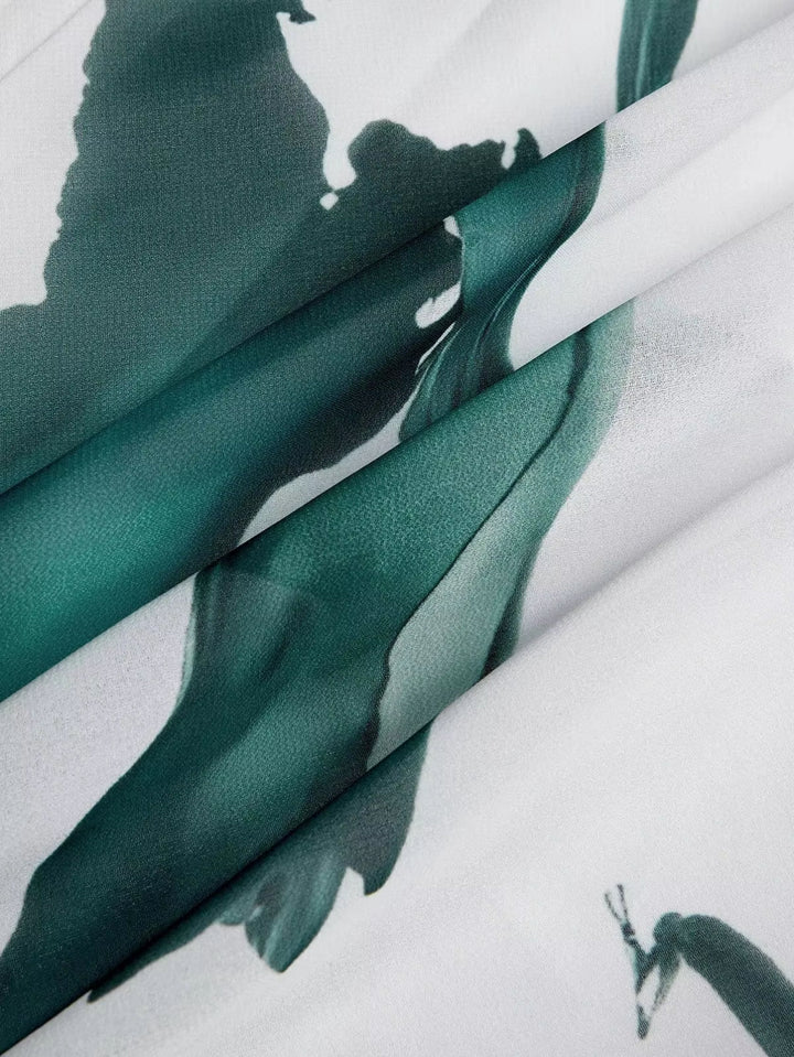 Graceful women's V-neck flowy maxi dress with a stunning watercolor print, ideal for elegant summer wear.