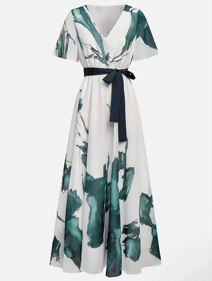 V-neck women's flowy maxi dress with vibrant watercolor print & tie waist, perfect for elegant summer events.
