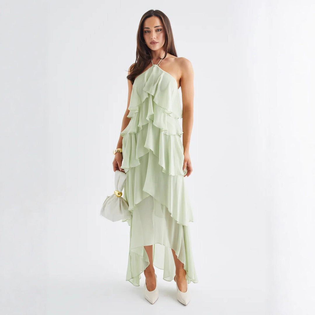 Stylish women's tiered ruffle maxi dress, featuring a flattering halterneck, suitable for formal summer parties.