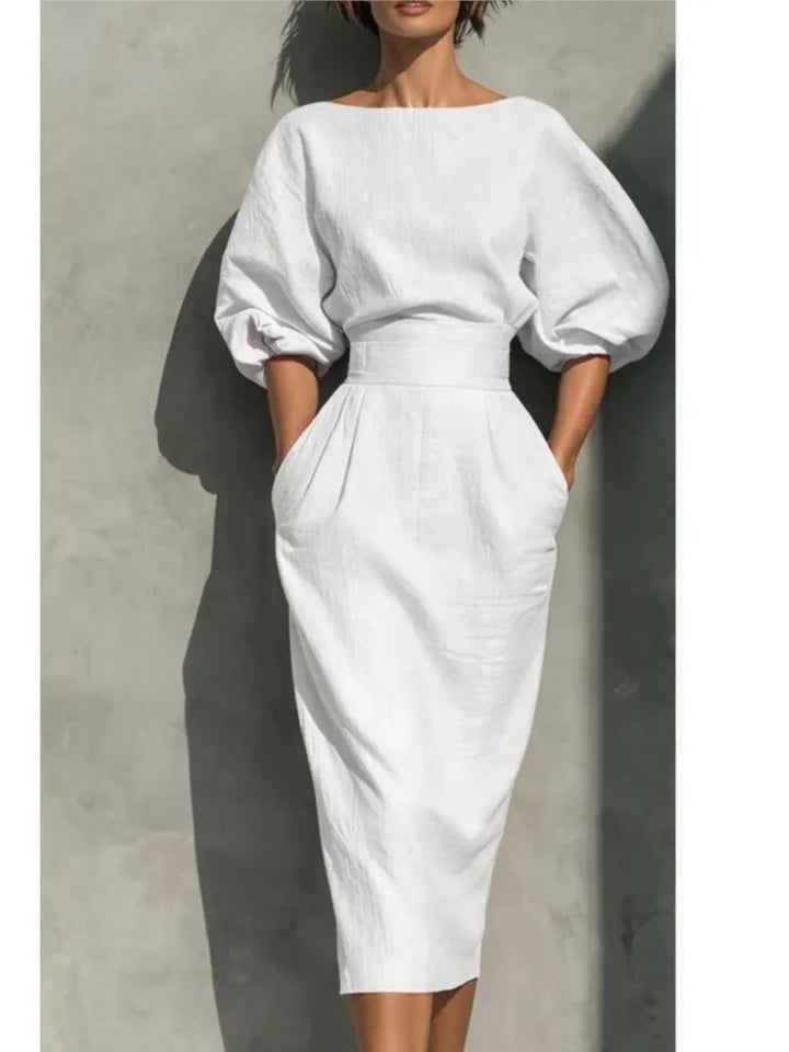 Stylish women's belted midi dress featuring elegant puff sleeves, a perfect choice for a special occasion.