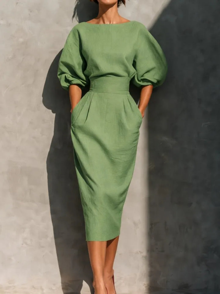 Women's fashion midi dress with elegant puff sleeves & belt, a sophisticated wedding guest or party outfit.