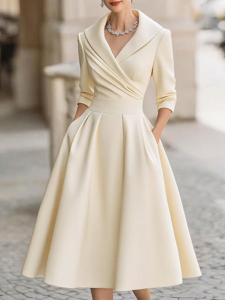 Wedding guest midi dress for women, elegant design with a draped collar, three-quarter sleeves & a flattering flared skirt.
