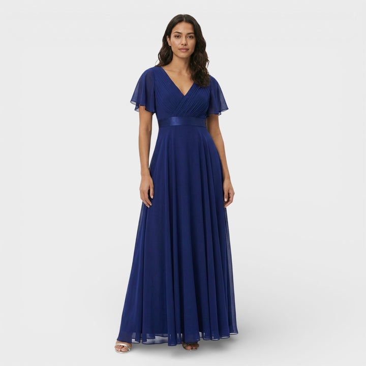 Detailed view of women's pleated maxi dress, showcasing the V-neck and elegant fabric drape.