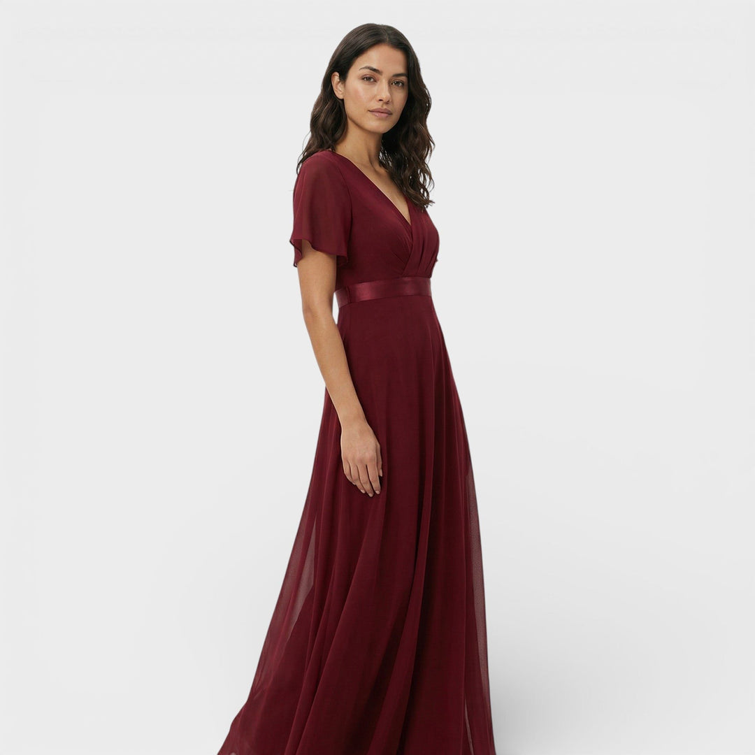 Women's elegant evening gown, a V-neck pleated maxi dress ideal for formal events and celebrations.
