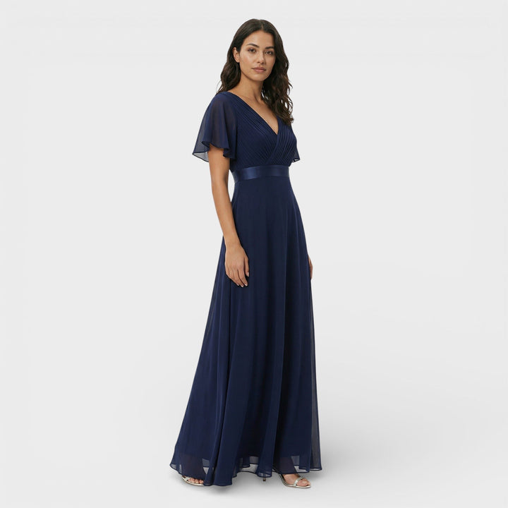 Chic black pleated maxi dress for women, V-neck design for a formal wedding guest outfit.