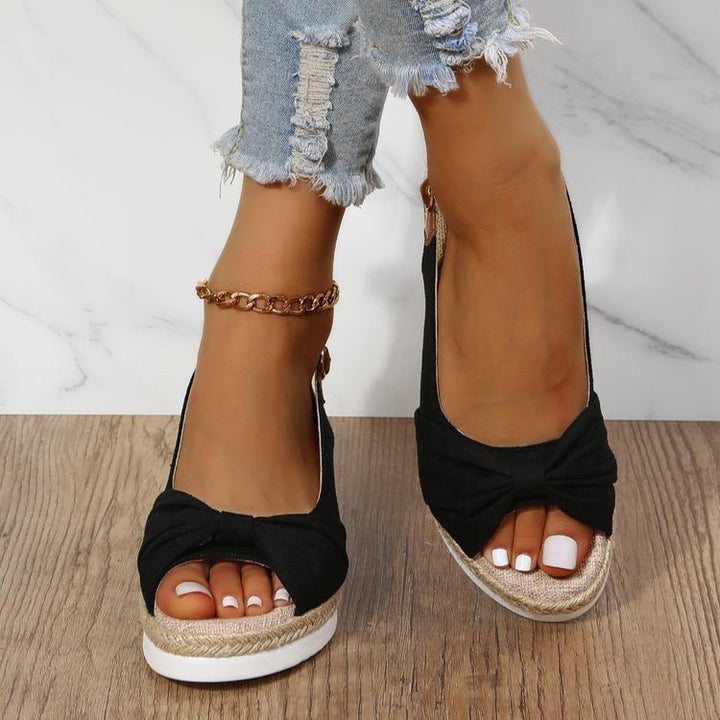 Elegant women's wedge sandals with chic knot detail, open toe, & slingback. Comfortable summer footwear for women.