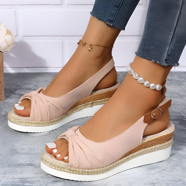 Comfortable women's wedge sandals with elegant knot detail. Stylish open-toe slingbacks, ideal for summer & casual wear.