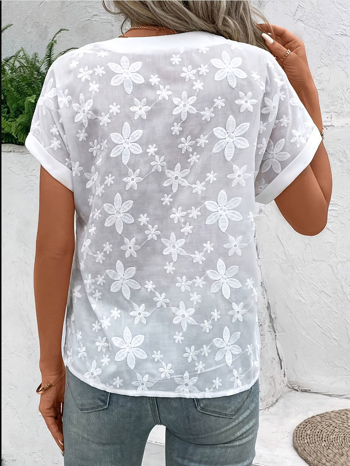 Graceful women's long sleeve white floral button-up shirt, an elegant blouse for versatile spring and summer fashion.