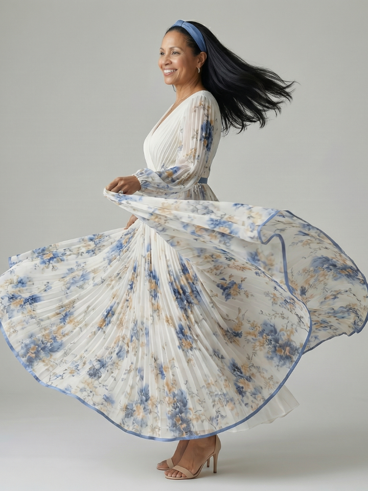 Model wearing a comfortable white floral midi wrap dress with a flowing pleated skirt, ideal for daytime or events.
