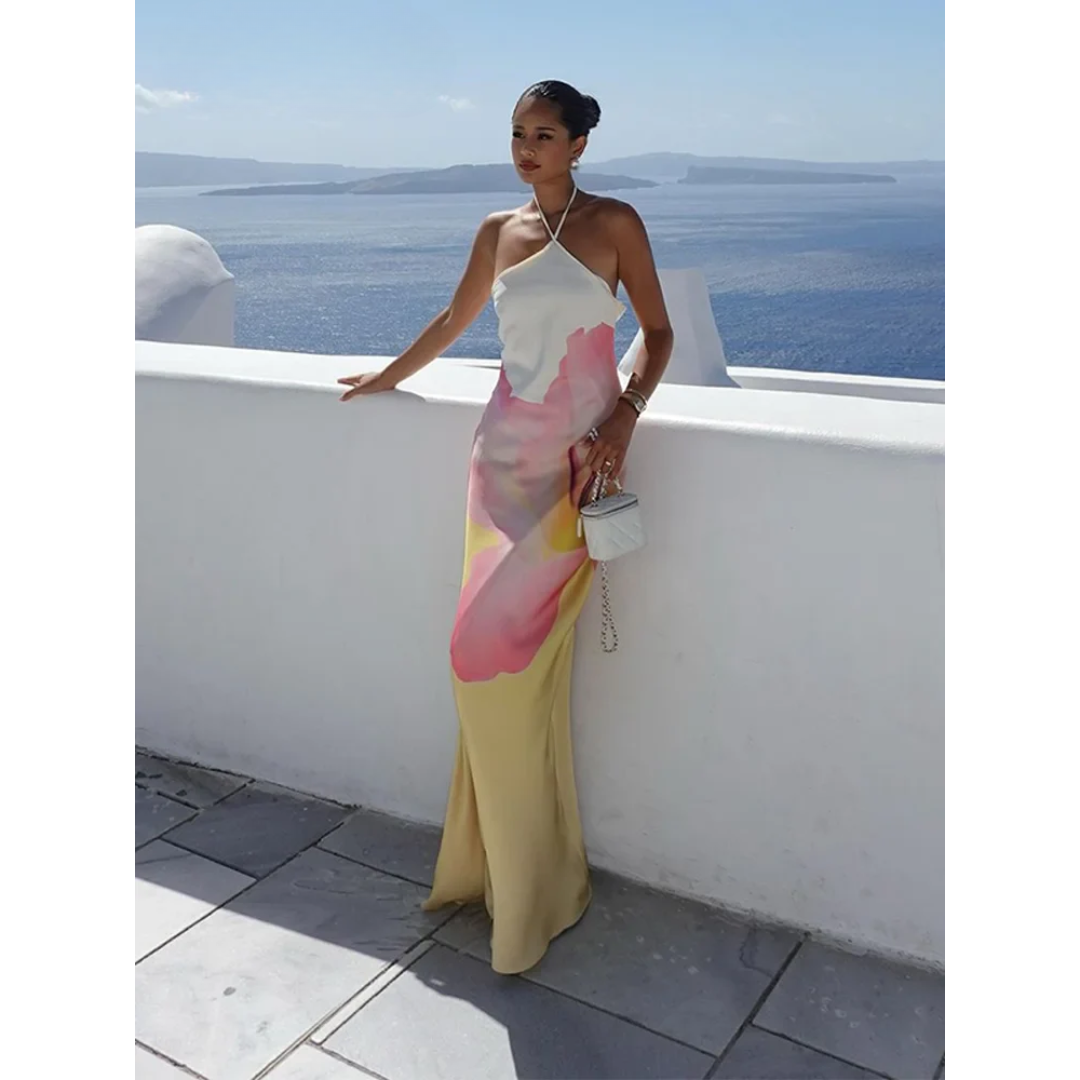 Beautiful one-shoulder white maxi dress with a stunning floral pattern, an elegant choice for women's occasion wear.