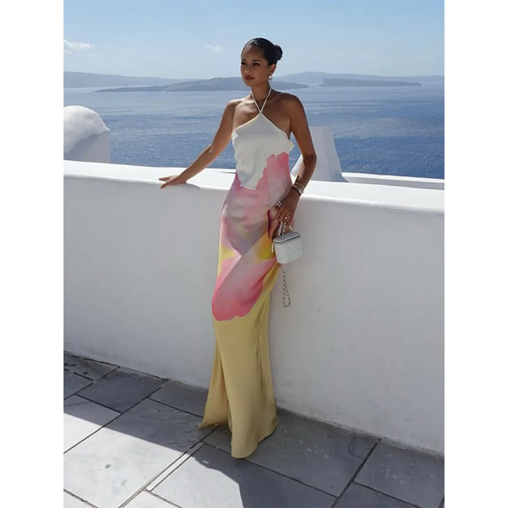 Beautiful one-shoulder white maxi dress with a stunning floral pattern, an elegant choice for women's occasion wear.