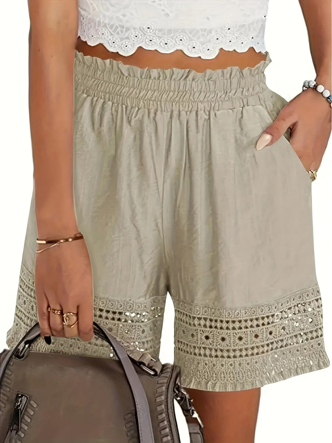 Elegant women's white shorts with delicate lace trim, stylish slant pockets. Perfect for summer chic & versatile wear.