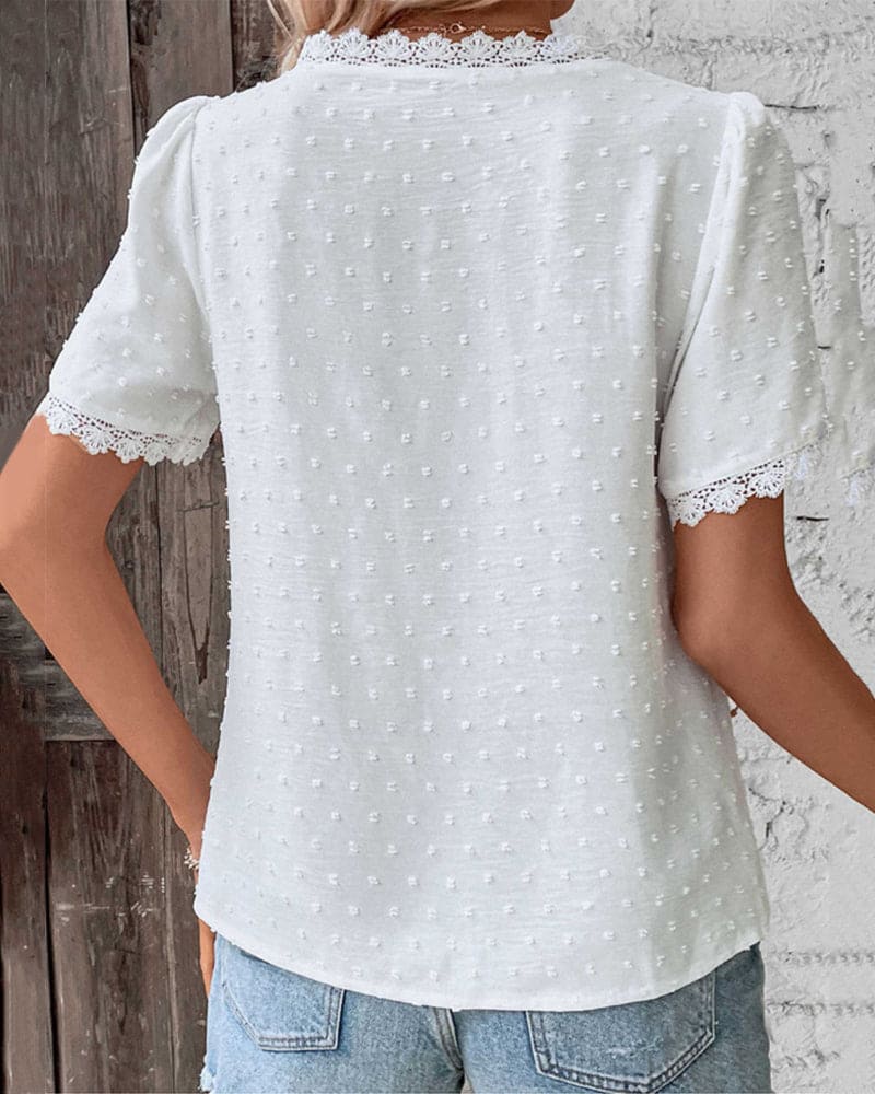 Boho style women's casual Swiss dot blouse with lace V-neck, perfect for summer everyday wear.