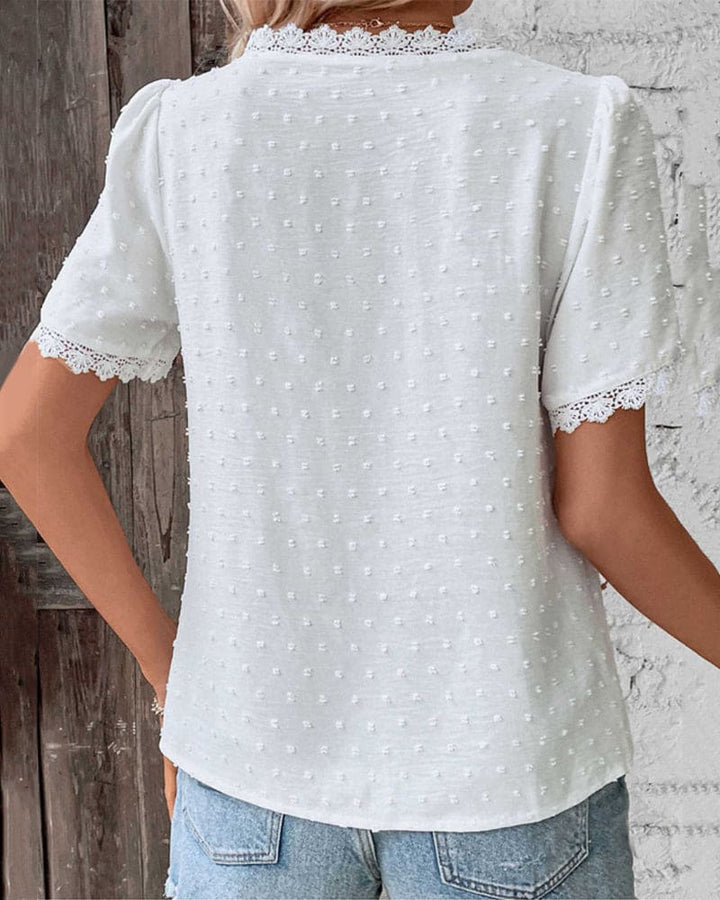 Boho style women's casual Swiss dot blouse with lace V-neck, perfect for summer everyday wear.